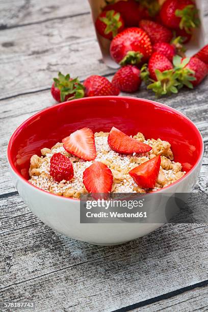granola, popped amarant and strawberries in bowl - amarant stock pictures, royalty-free photos & images