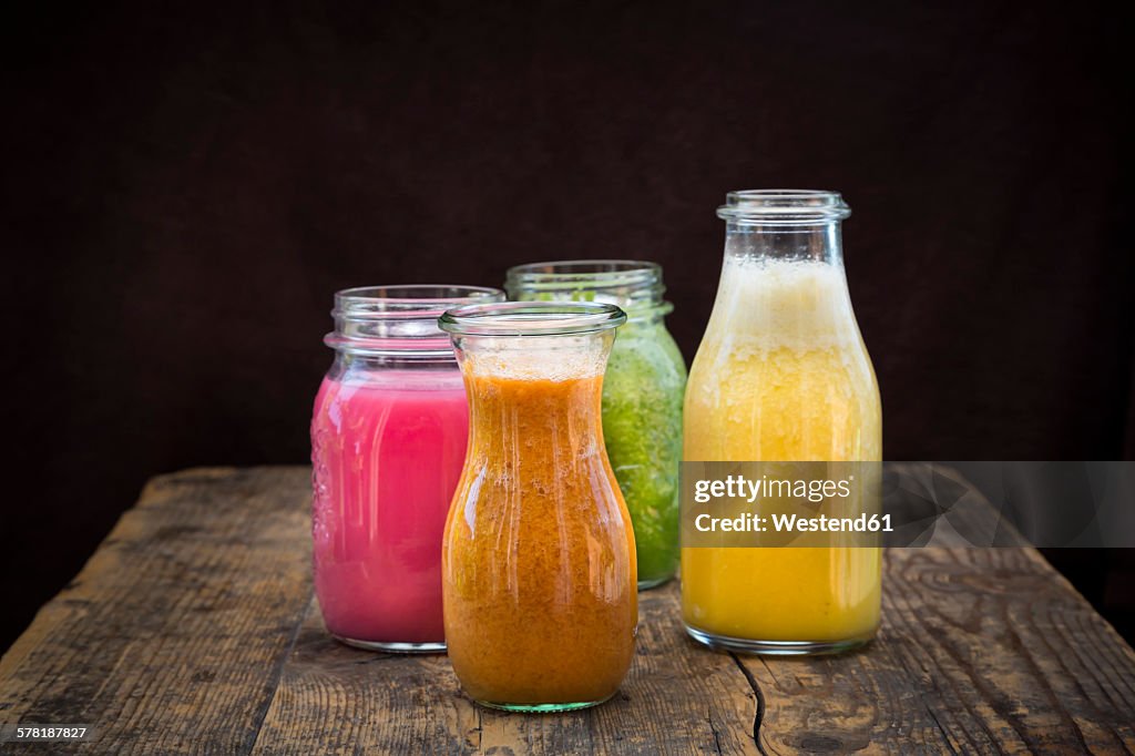 Four glasses of different smoothies