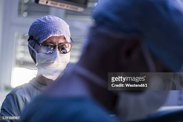 two surgeons in operating room - operating room ストックフォトと画像