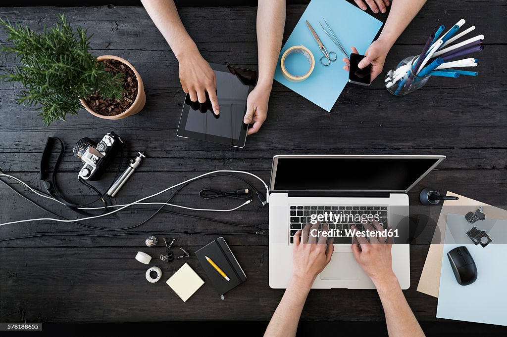 Working at home office with laptop, smartphone and digital tablet