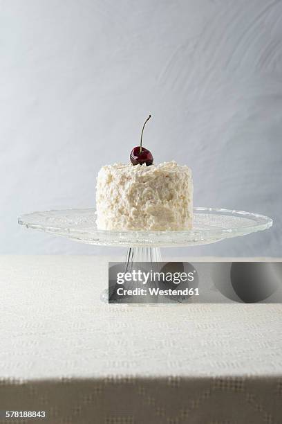 cocos cherry cake with cocos butter cream on cake stand - cakestand stock pictures, royalty-free photos & images
