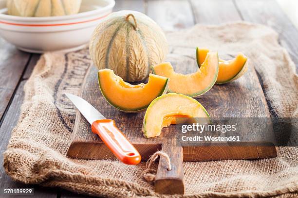 whole and sliced charentais melon - charentais stock pictures, royalty-free photos & images