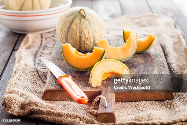 whole and sliced charentais melon - rockmelon stock pictures, royalty-free photos & images