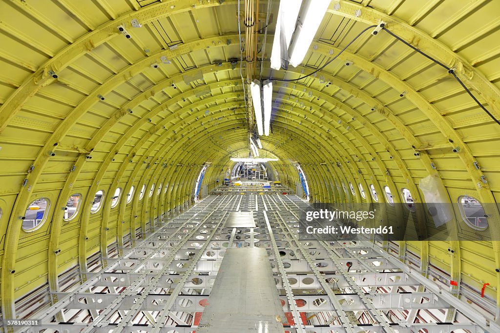 Interior of an unfinished airplane in a hangar