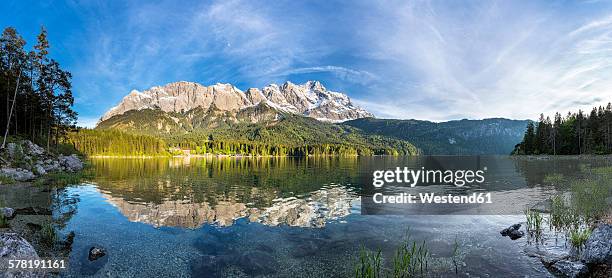 germany, bavaria, grainau, wetterstein mountains, eibsee lake with zugspitze - alpes de bavaria fotografías e imágenes de stock