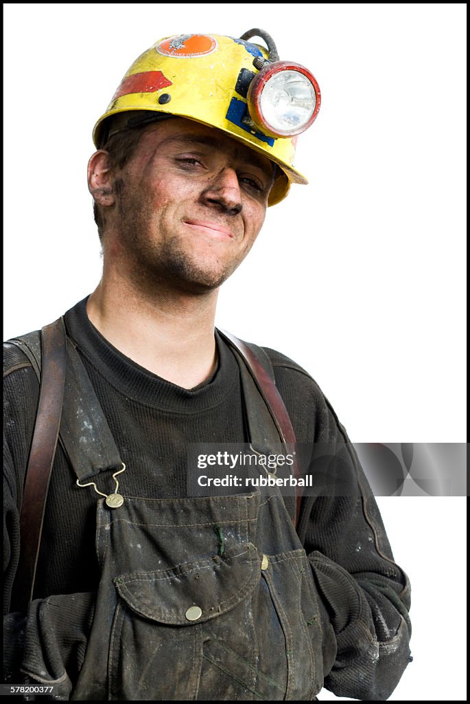 Mine worker with flashlight helmet