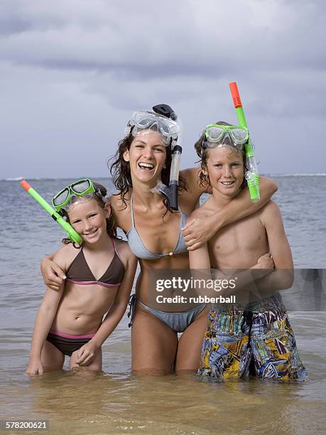 portrait of a mother and her children wearing snorkel gear - preteen girl no shirt stock pictures, royalty-free photos & images