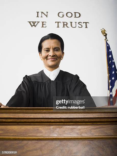 portrait of a female judge smiling - judge bench stock pictures, royalty-free photos & images