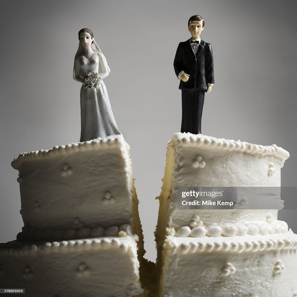 Wedding cake visual metaphor with figurine cake toppers