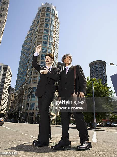 two mannequins portraying businessmen - futurista bildbanksfoton och bilder