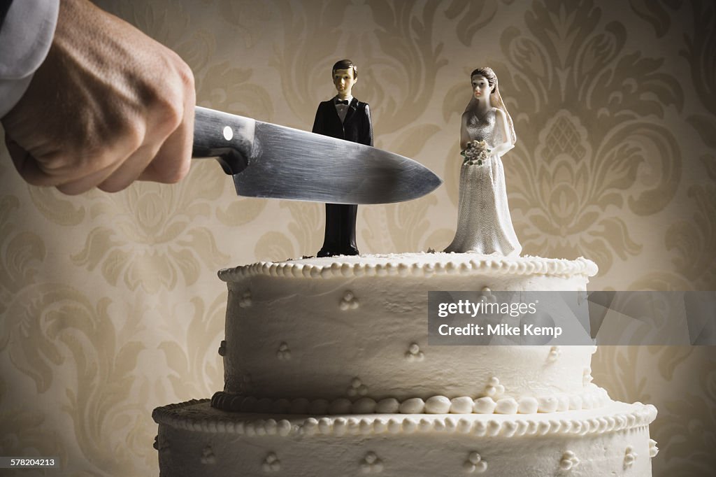 Wedding cake visual metaphor with figurine cake toppers