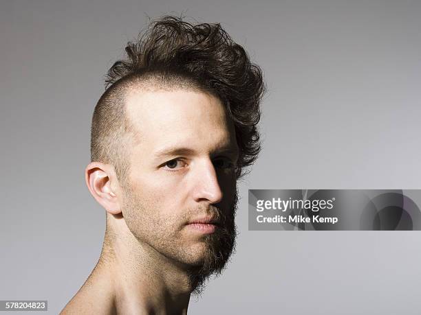 shirtless man with half shaved hair and beard - half shaved hair stock pictures, royalty-free photos & images