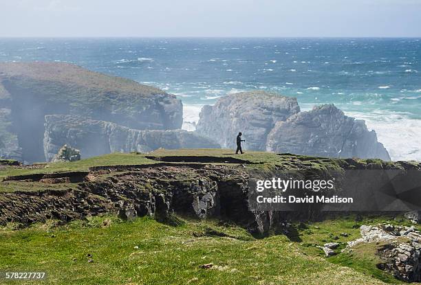 person walking near butt of lewis. - day lewis imagens e fotografias de stock