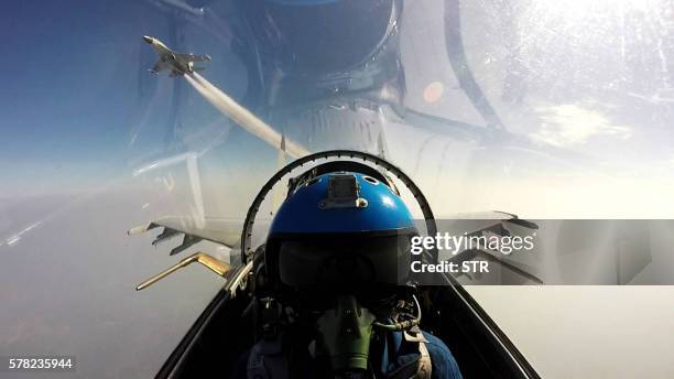 This undated photo shows two Chinese jet fighters during a military drill in the South China Sea near China's Hainan Island. An area off the east...