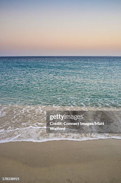 beach and ocean waves, naxos island, greece - naxos stock-fotos und bilder