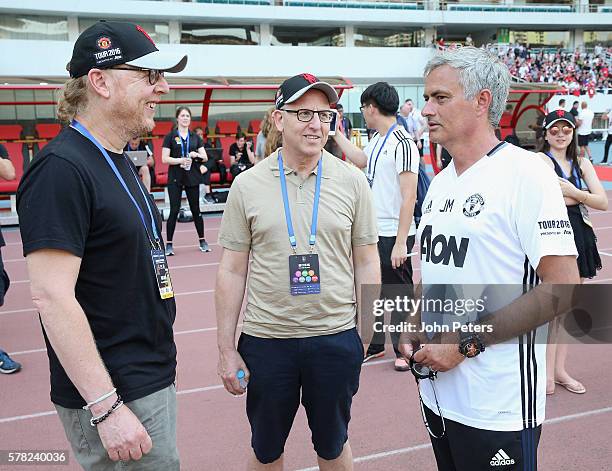 Avram Glazer and Joel Glazer speak to Manager Jose Mourinho of Manchester United during a first team training session as part of their pre-season...