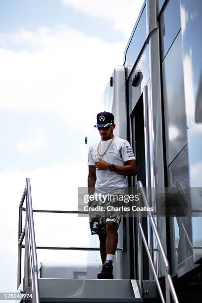 Lewis Hamilton of Great Britain and Mercedes GP walks in the Paddock during previews ahead of the Formula One Grand Prix of Hungary at Hungaroring on...