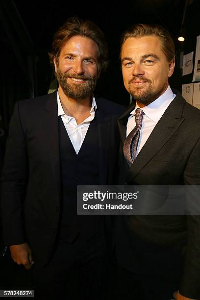 Bradley Cooper and Leonardo DiCaprio attend the Dinner & Auction during The Leonardo DiCaprio Foundation 3rd Annual Saint-Tropez Gala at Domaine...