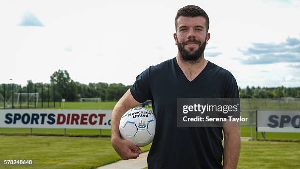 Grant Hanley poses for photographs holding a football at the Newcastle United Training Centre on July 21 in Newcastle upon Tyne, England.