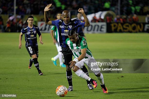 Julio Angulo of Independiente del Valle battles for the ball with Farid Diaz of Atletico Nacional during a first leg final match between...