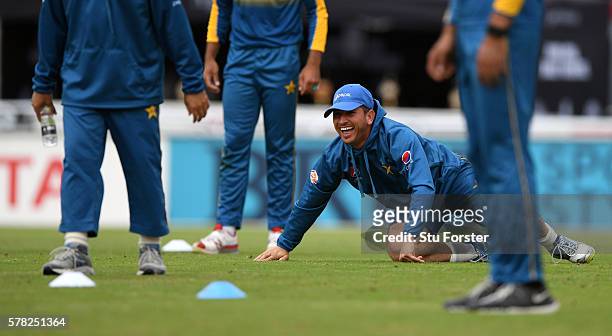 Pakistan bowler Yasir Shah shares a joke with team mates during Pakistan Nets ahead of the 2nd Investec test match against England at Old Trafford on...