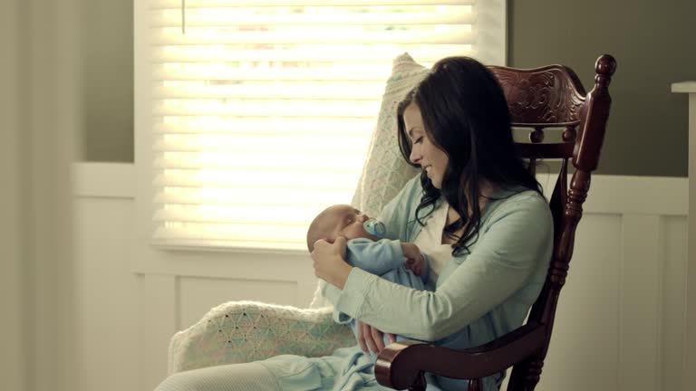 Mother Rocking 199 Mom And Baby In Rocking Chair Stock Videos, Footage, & 4K Video ...