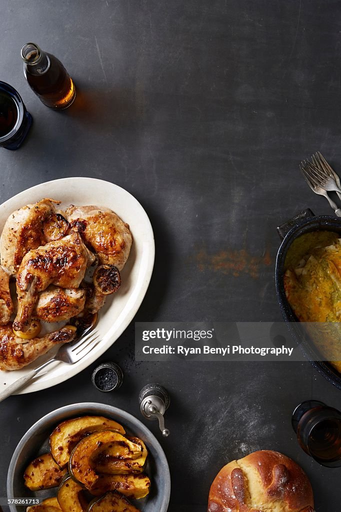 Day of the Dead food with roasted chicken and mole poblano sauce, acorn squash and enchiladas