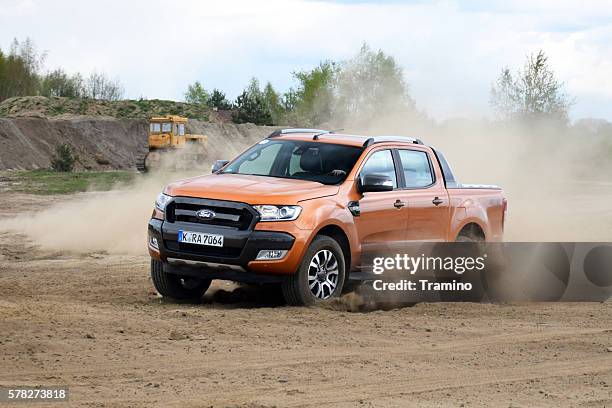 ford ranger driving on the unmade road - pick up stock pictures, royalty-free photos & images