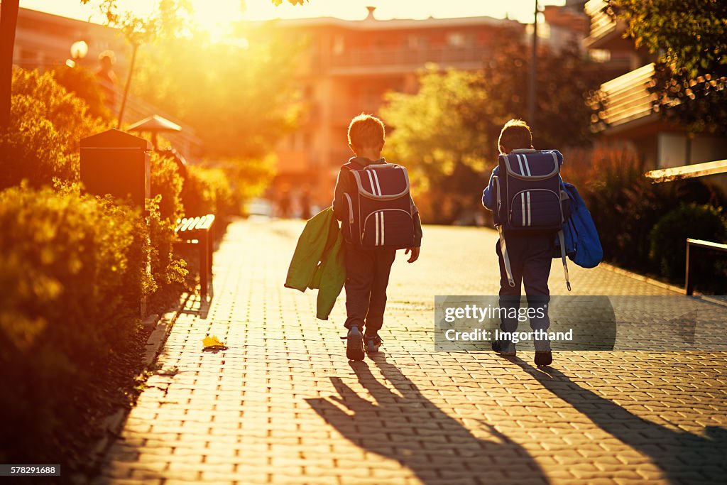 Two little boys returning from school