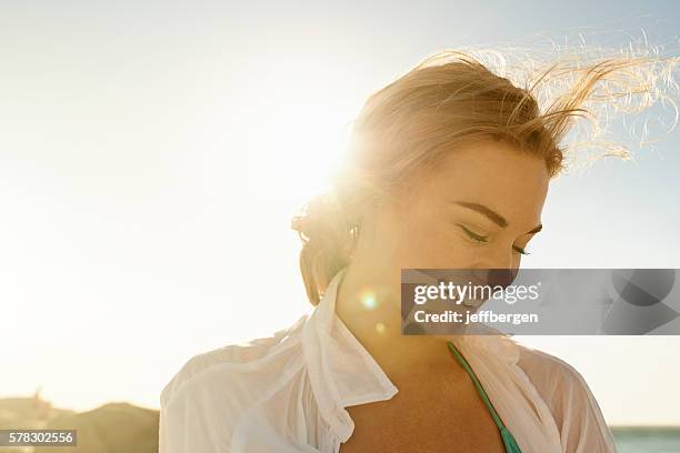 solo in the sun - women beach stockfoto's en -beelden