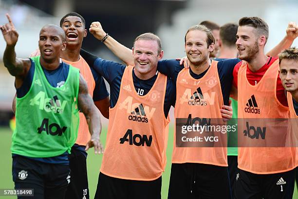 Wayne Rooney, Daley Blind and David de Gea of Manchester United attends first team training session as part of their pre-season tour of China during...