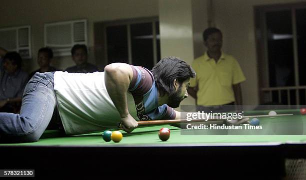 Film actor Aftab Shivdasani of CCI playing against Juhu Vileparle Gymkhana in the semifinal match of Mumbai Snooker league.