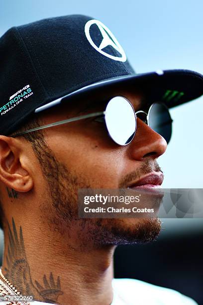 Lewis Hamilton of Great Britain and Mercedes GP talks in the Paddock during previews ahead of the Formula One Grand Prix of Hungary at Hungaroring on...
