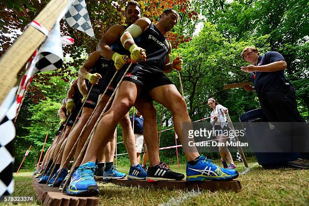 Haydn Thomas of Exeter Chiefs leads his team through an obstacle during a team building exercise at River Dart Country Park on July 21, 2016 in...