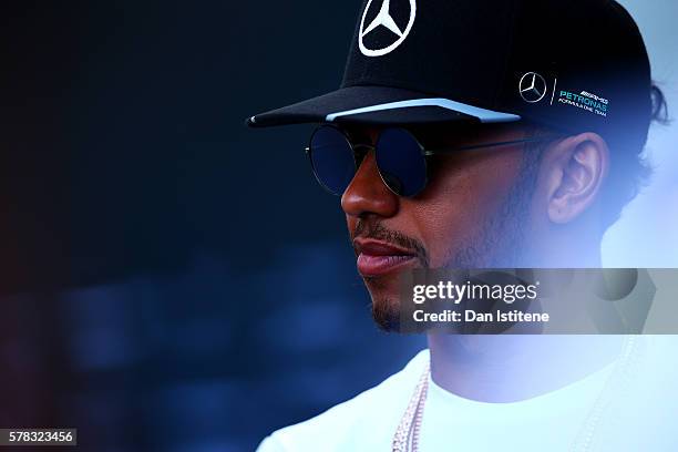 Lewis Hamilton of Great Britain and Mercedes GP looks on in the paddock during previews ahead of the Formula One Grand Prix of Hungary at Hungaroring...