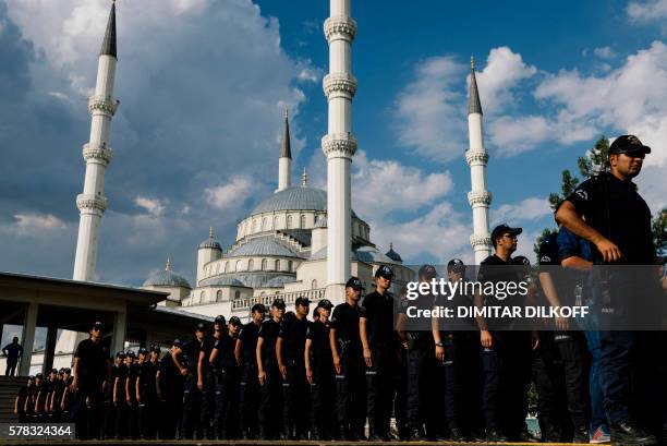 Turkish policemen attend the funeral ceremony of special forces police officer Meric Alemdar killed during the failed July 15 coup, at the Kocatepe...