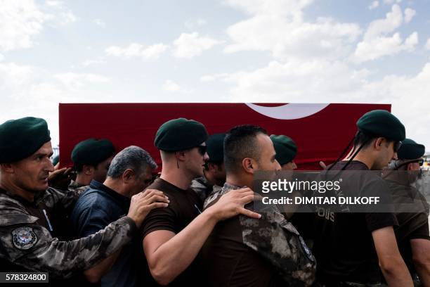 Turkish special forces policemen carry the coffin of the officer Meric Alemdar killed during the failed July 15 coup attempt, at a funeral ceremony...