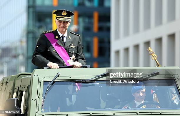 King Philippe of Belgium salutes the crowd during the parade as part of the ceremonies marking Belgium's National Day on July 21, 2016 in Brussels,...
