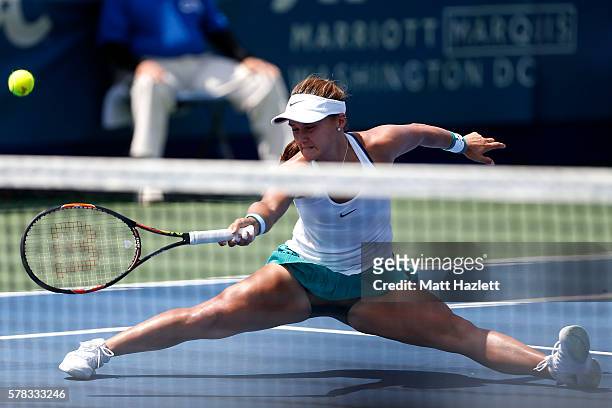 Lauren Davis of the United States of America attempts to return a shot to Monica Puig of Puerto Rico during day 4 of the Citi Open at Rock Creek...