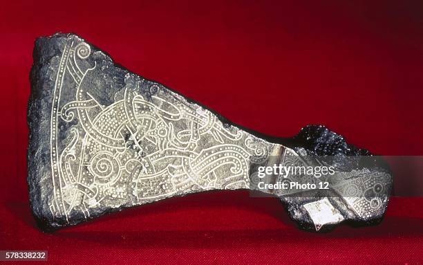 Viking art The great axe from Mammen, Jutland. The design, inlaid with silver wire, depicts a bird-animal with limbs like acanthus and spiralling...