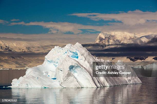 the gerlache strait separating the palmer archipelago from the antarctic peninsular off anvers island. the antartic peninsular is one of the fastest warming areas of the planet. - glacial motion stock pictures, royalty-free photos & images