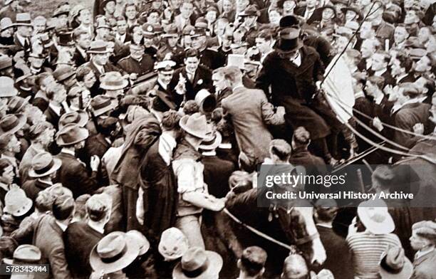 Photograph of Prince Albert Frederick Arthur George with students after he received an honorary degree of Doctor of Law at Melbourne University....