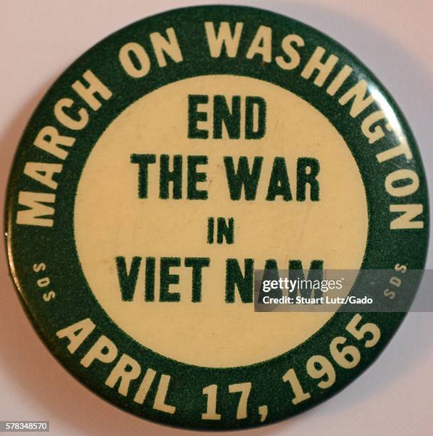 An anti-Vietnam War pin that features the text 'End the war in Vietnam' in the center, text reading 'March on Washington' and 'April 17, 1965' run...