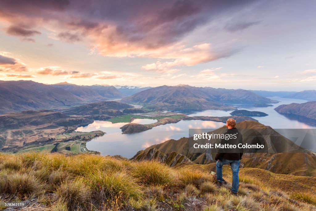 Man looking at scenic landscape, New Zealand