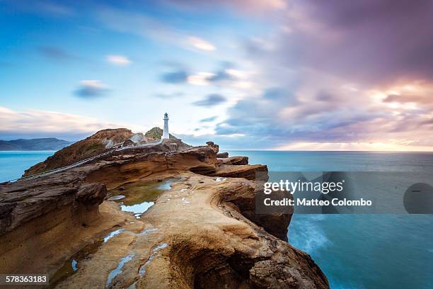 castle point lighthouse at sunrise, new zealand - new zealand landscape stock pictures, royalty-free photos & images