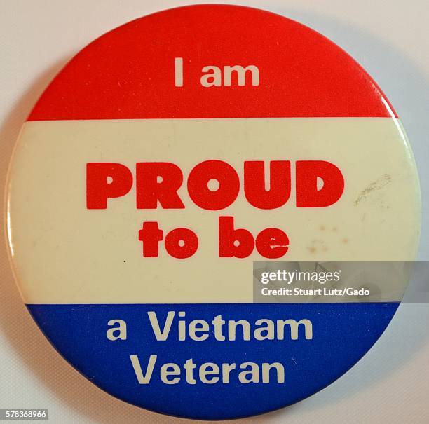 Pin that supports the war effort in Vietnam contains the text 'I am proud to be a Vietnam Veteran', the background is red, white and blue, 1968. .