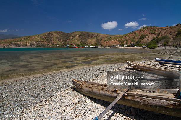 fisherman boat in tibas beach, dili - dili stock pictures, royalty-free photos & images