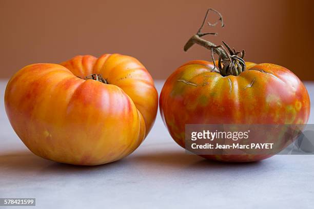 true organic tomatoes "beef heart" - jean marc payet stock pictures, royalty-free photos & images