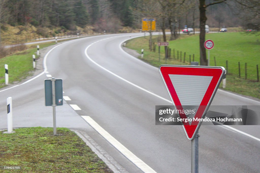 A yield road sign in a European road