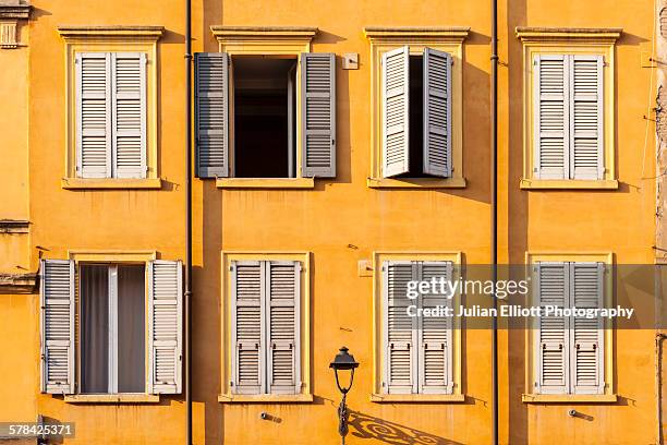 colorful house facades in piazza xx settembre - modena stockfoto's en -beelden